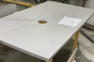 Quartz shower pan with starburst marks left in per customer request